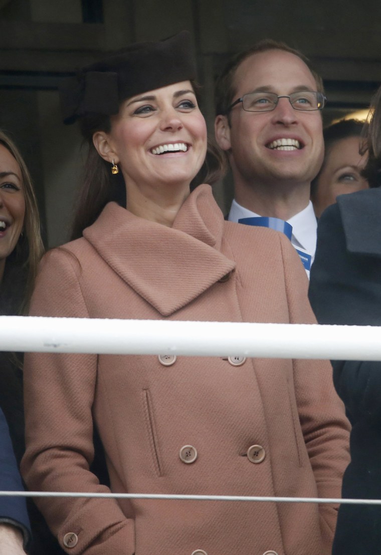Image: Britain's Prince William and his wife Catherine, Duchess of Cambridge, react during the second race at the Cheltenham Festival horse racing meet in Gloucestershire